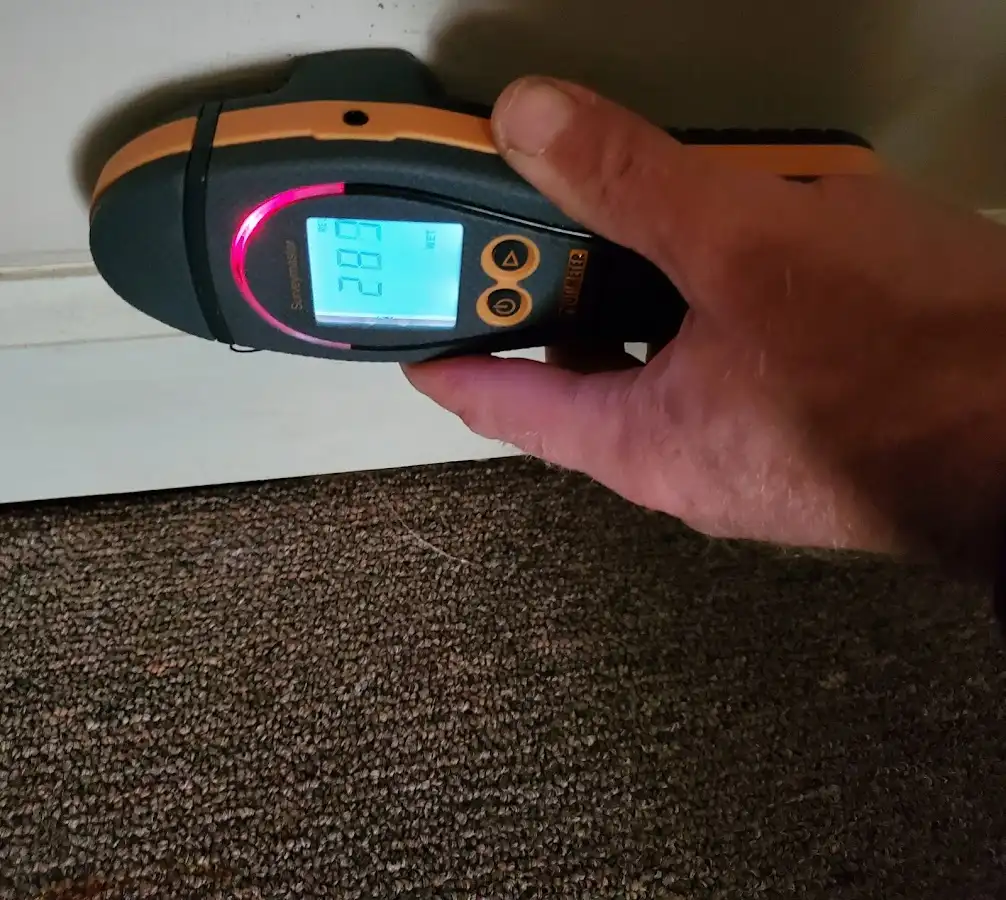 Moisture detection at baseboard during Sewage Cleanup & Sanitation in Oxford